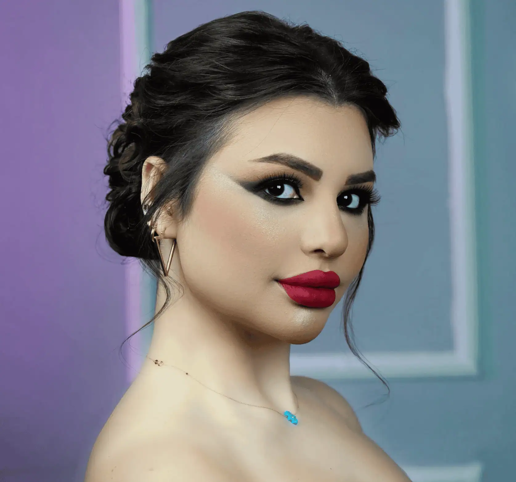 Professional makeup artist applying luxury foundation at Tripoli salon